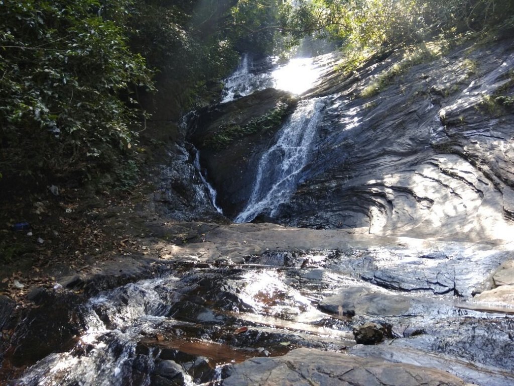 Hidlumane Falls in Shimogga, Karnataka, a stunning multi-tiered waterfall nestled in a lush green landscape, offering a serene and scenic escape.